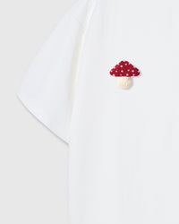 Back detail of Mushroom T-Shirt in white showing single plush mushroom