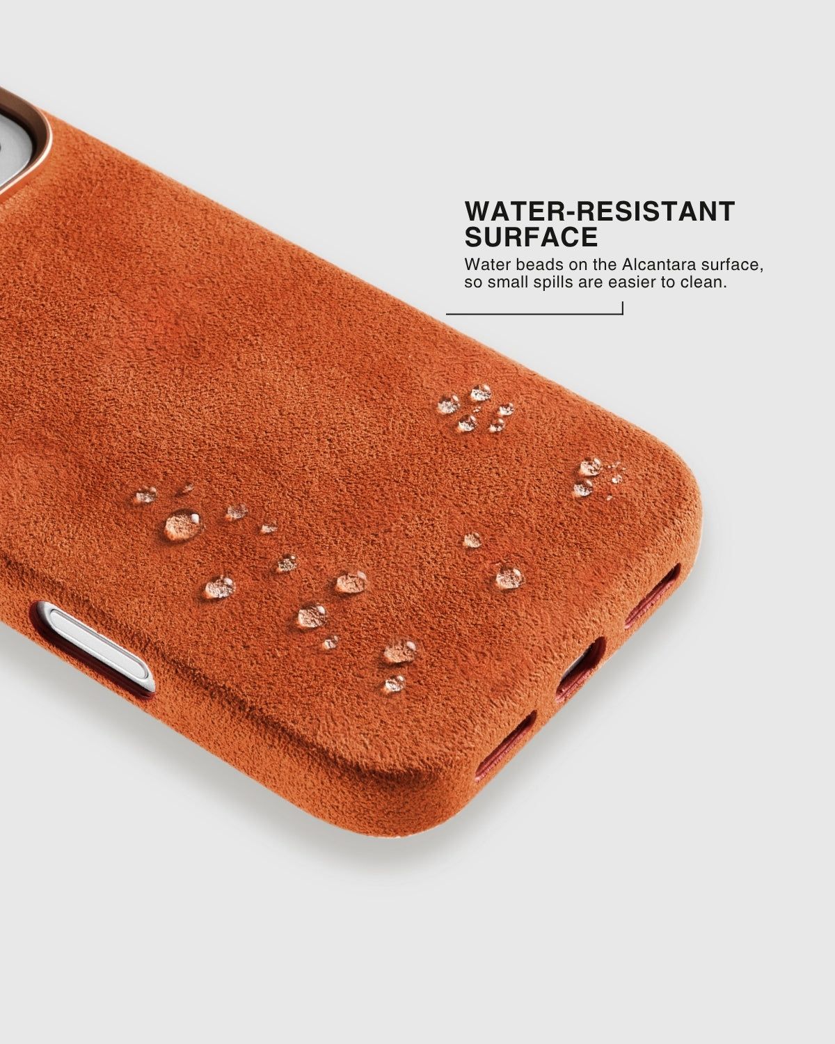 Water droplets beading on warm burnt orange Alcantara phone case surface by STICKYZOO