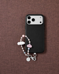 Blush Cloud phone strap styled on fabric, loved by thousands of STICKYZOO customers