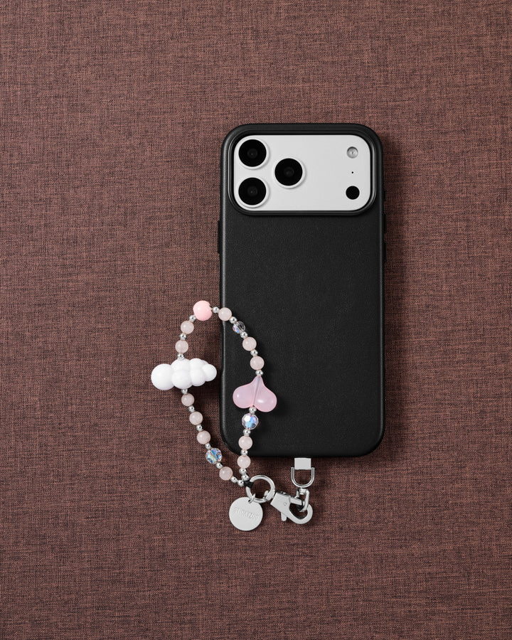 Blush Cloud phone strap styled on fabric, loved by thousands of STICKYZOO customers