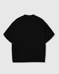 Back view of STICKYZOO black Runaway Croissant T-Shirt showing boxy silhouette and ribbed neckline