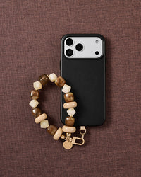 Toffee marbled bead phone strap styled on fabric, loved by thousands of STICKYZOO customers