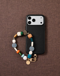 Safari mixed bead phone strap styled on fabric, loved by thousands of STICKYZOO customers