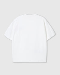 Detail view of plush heart placement on STICKYZOO white cotton tee