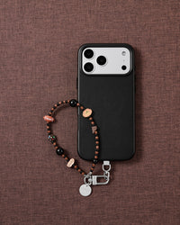 Puppy picnic charm phone strap styled on fabric, loved by thousands of STICKYZOO customers