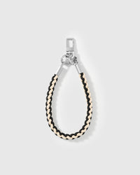 Detail of the black and cream braided accent on the STICKYZOO cross-body phone strap