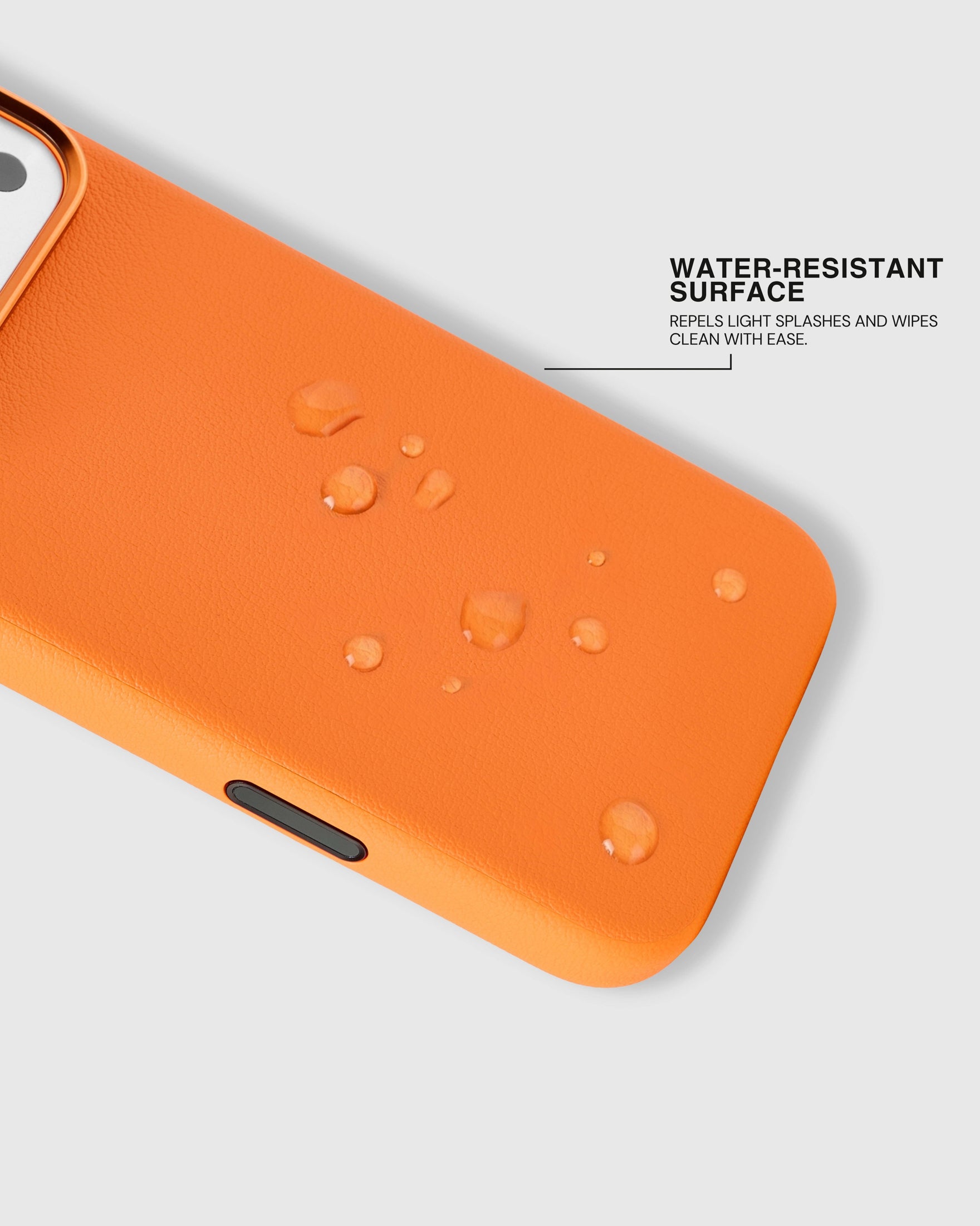 Water beading on the splash-resistant surface of the orange STICKYZOO leather phone case
