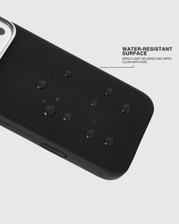 Water beading on the splash-resistant surface of the black STICKYZOO leather phone case