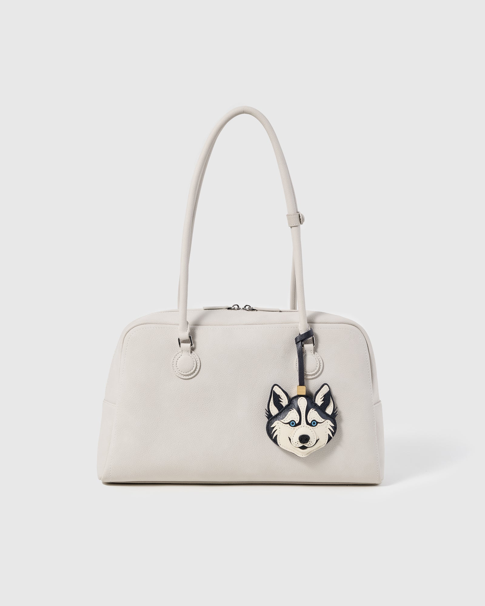 {{Clips to any bag}} STICKYZOO husky charm attached to off-white structured handbag showing bag charm styling