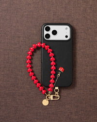 Crimson ladybug heart phone strap flat-lay — Designed in Amsterdam