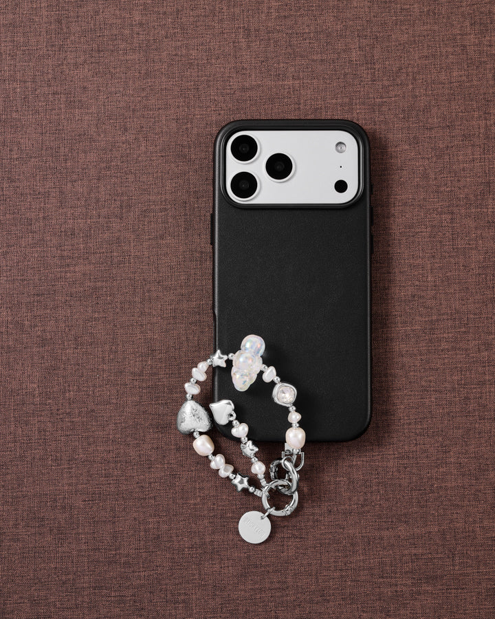 Pearl and silver beaded phone strap on brown fabric: iridescent cloud bead, silver stars, faceted clear gem, foil heart and STICKYZOO disc