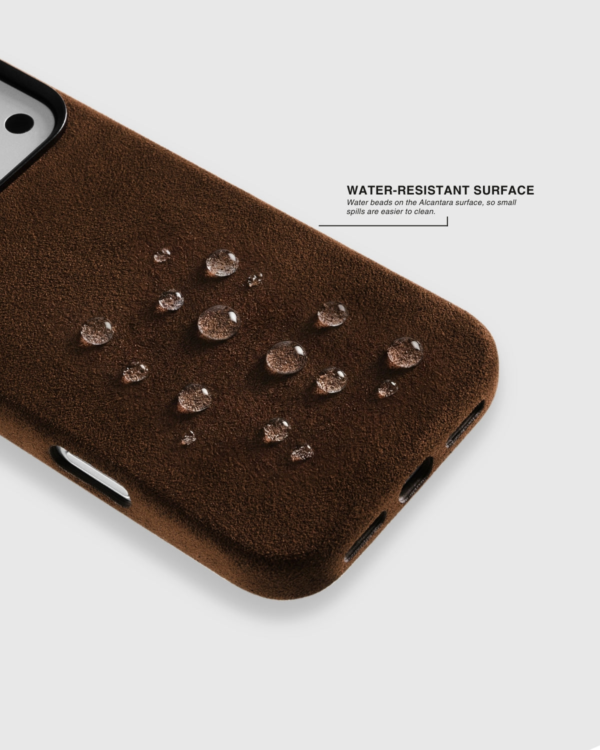 {{Light splash-resistant}} Water droplets beading on espresso brown Alcantara phone case surface by STICKYZOO