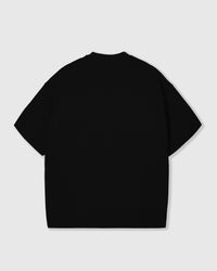 Flat-lay of black Triple Heart T-Shirt with all three plush hearts visible