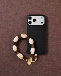 Cocoa marbled bead phone strap styled on fabric, loved by thousands of STICKYZOO customers