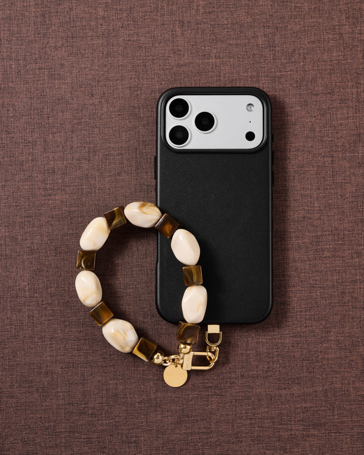 Cocoa marbled bead phone strap styled on fabric, loved by thousands of STICKYZOO customers