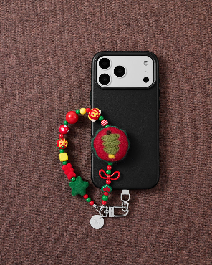 Christmas Tree phone strap styled on fabric, loved by thousands of STICKYZOO customers