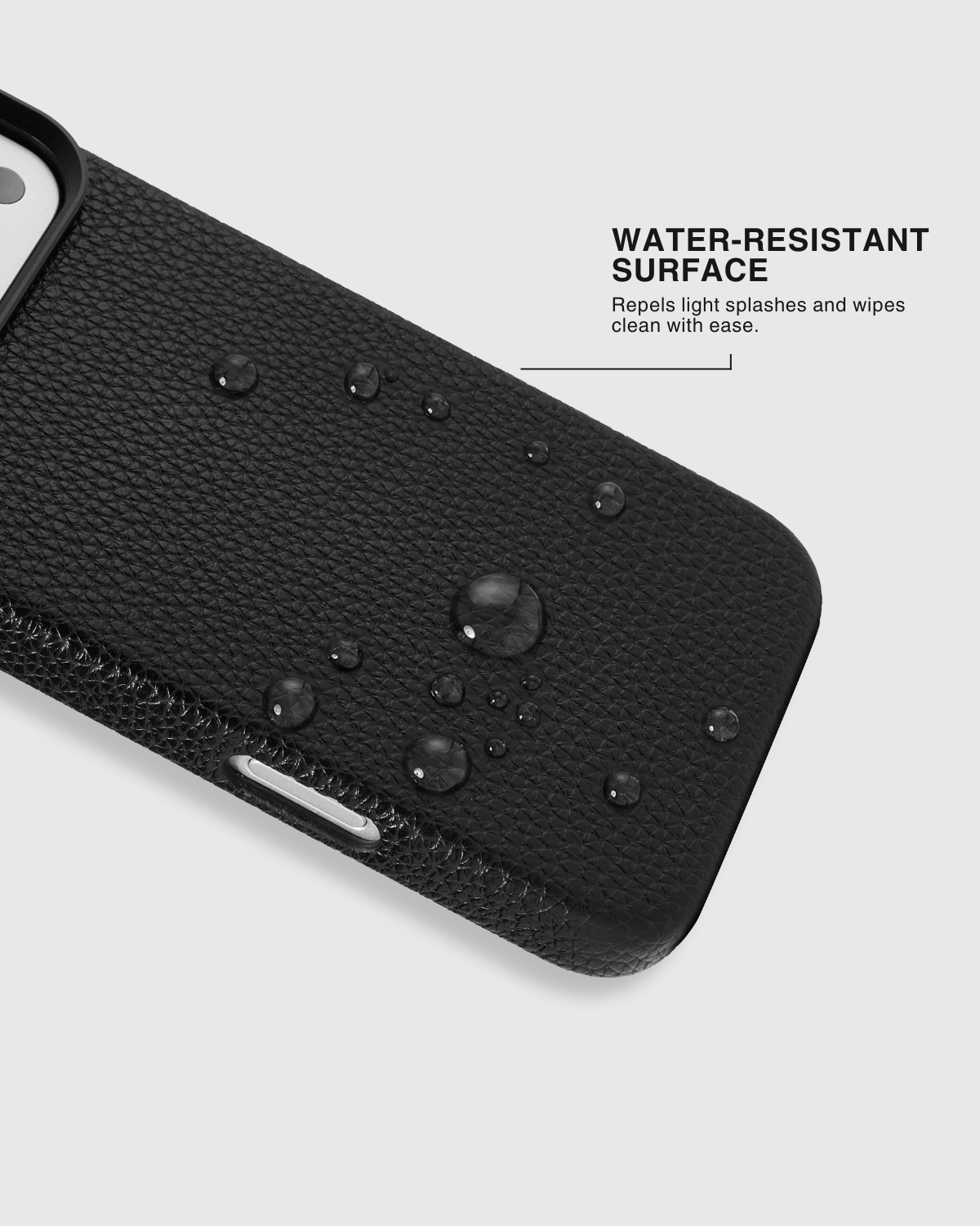 {{Water-resistant surface.}} STICKYZOO Evil Eye Heart Talisman Charm Case with water droplets on black vegan leather, easy-wipe pebbled texture