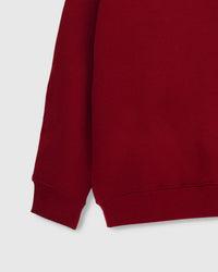 Back view of STICKYZOO red Teddy Bear Sweatshirt showing boxy silhouette and ribbed neckline