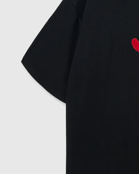 Model wearing STICKYZOO Shrimp Hug T-Shirt in black showing dropped shoulders