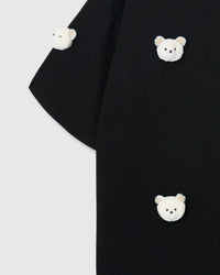 Multiple bear appliques on STICKYZOO black tee showing dimensional scatter pattern