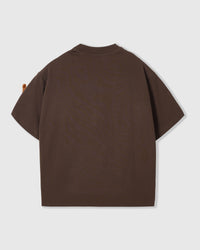 Back view of STICKYZOO Dash Dachshund T-Shirt in brown showing boxy silhouette and ribbed neckline