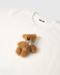 Detail of hand-stitched teddy bear applique on STICKYZOO white sweatshirt showing dimensional craft