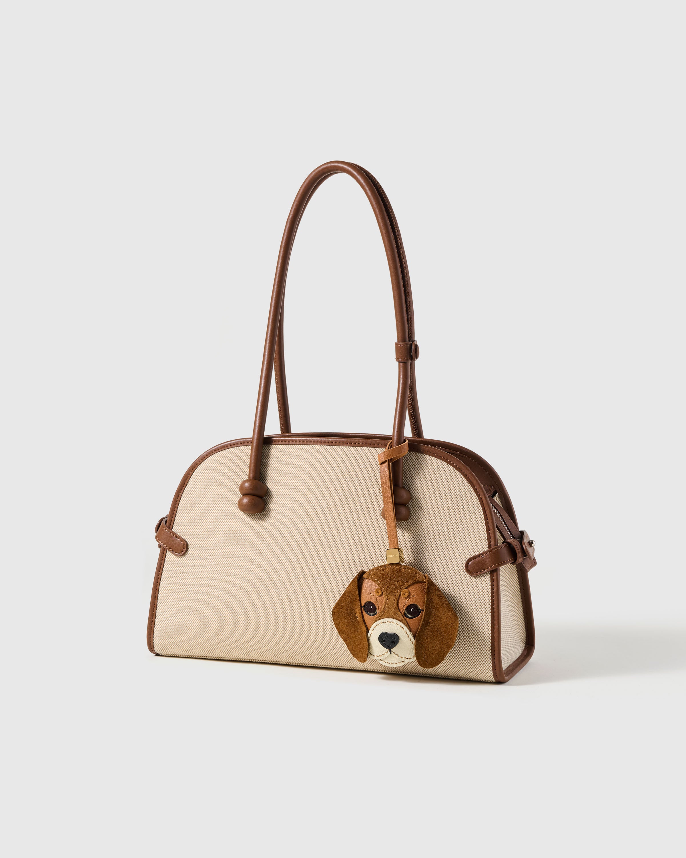 {{"People stop me to ask about it." — Mia K.}} beagle charm on bag — French Alran goatskin face with alcantara suede floppy ears. Handmade. Designed in Amsterdam.