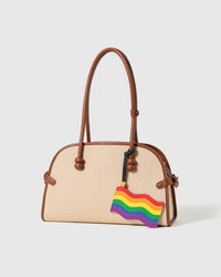 Handmade pride flag charm on canvas bag — six hand-stitched rainbow leather layers by STICKYZOO