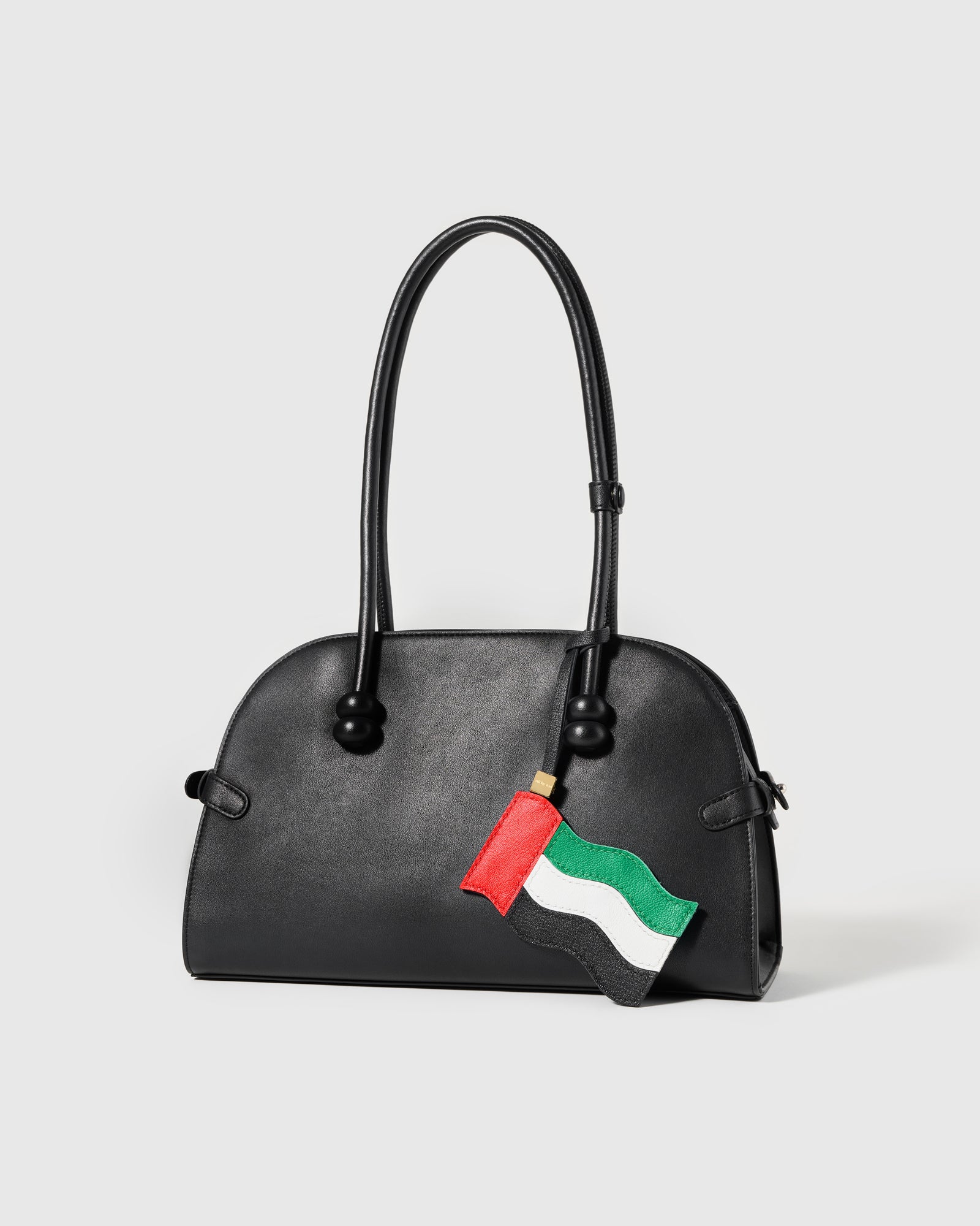 Handmade UAE flag charm on black bag — French Alran goatskin leather by STICKYZOO