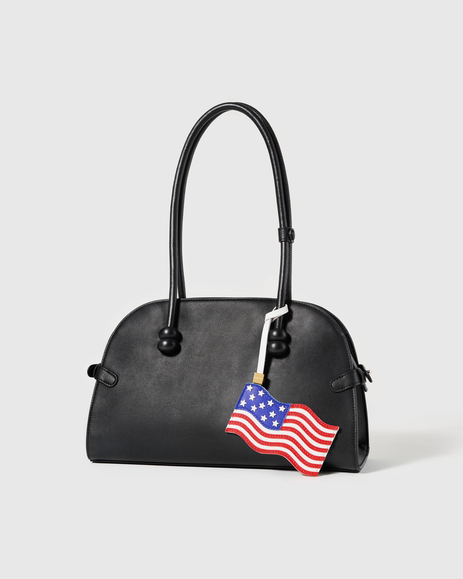 {{Rated 4.9 by thousands}} Handmade American flag leather charm on cream bag — waving Stars and Stripes by STICKYZOO