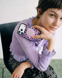 Everyday carry of the violet leopard phone case with its MagSafe grip and stand on the back
