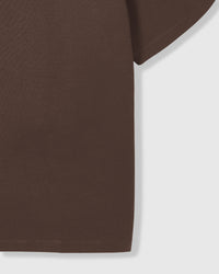Close-up of sleeve and side seam on brown Spotty Dash T-Shirt showing fabric weight