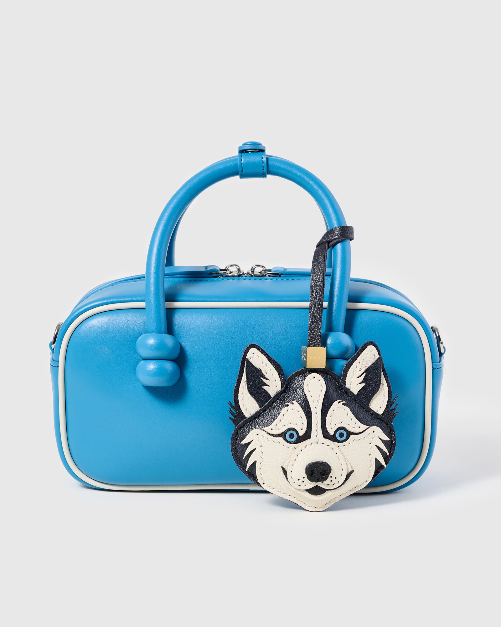 {{Pairs with any colour}} Husky charm on blue mini bowling bag showing contrast styling by STICKYZOO
