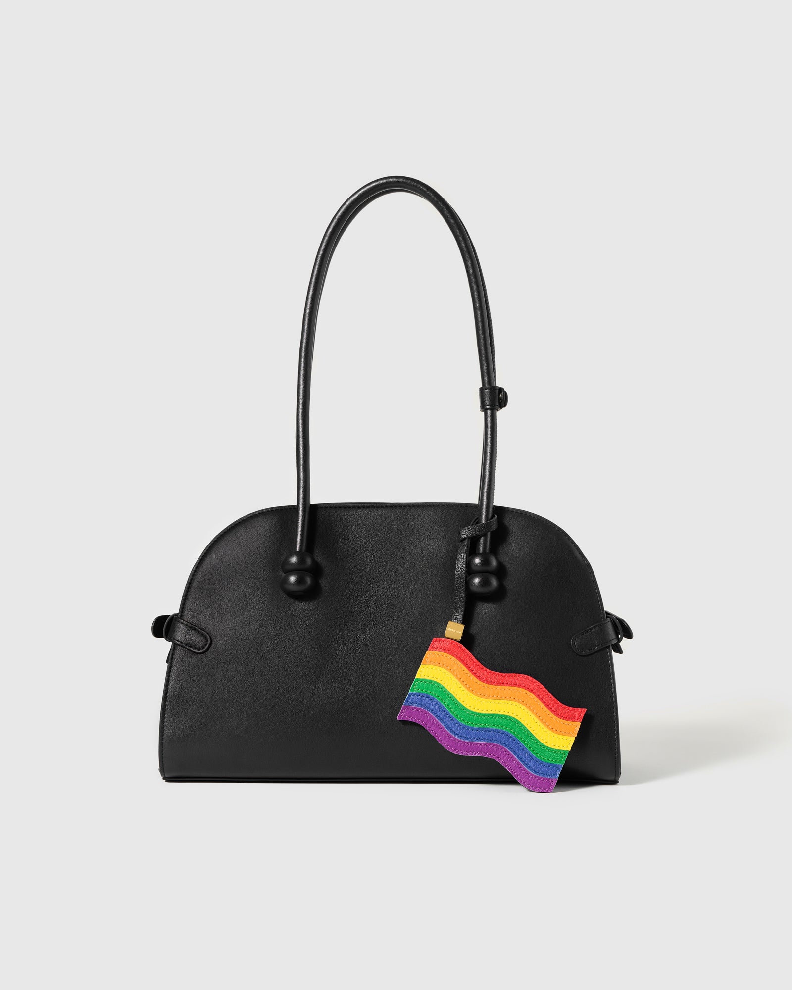 Rainbow pride flag leather charm on black structured handbag by STICKYZOO