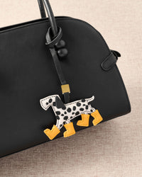 Handmade Dalmatian Rain Boots leather bag charm with 18K gold-plated keychain clip and engraved STICKYZOO gold tag — for keys, bags, and backpacks. French Alran goatskin.