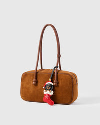 Santa Dachshund Stocking leather bag charm shown in both attachment options — handmade French Alran goatskin holiday charm, dual attachment. STICKYZOO Amsterdam design.