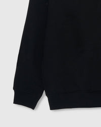 Back view of STICKYZOO black Teddy Bear Sweatshirt showing boxy silhouette and ribbed neckline
