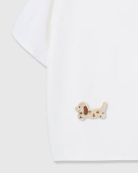 Detail of hand-stitched dachshund applique on white 230gsm cotton showing floppy ears