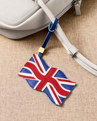 Union Jack leather charm on cream bag — handmade British flag in French Alran goatskin by STICKYZOO