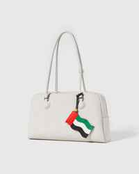 UAE flag leather charm on off-white handbag — handmade waving flag silhouette by STICKYZOO