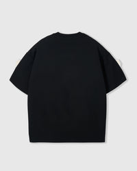 Back view of black Teddy Check-Ear Charm T-Shirt showing dropped shoulders