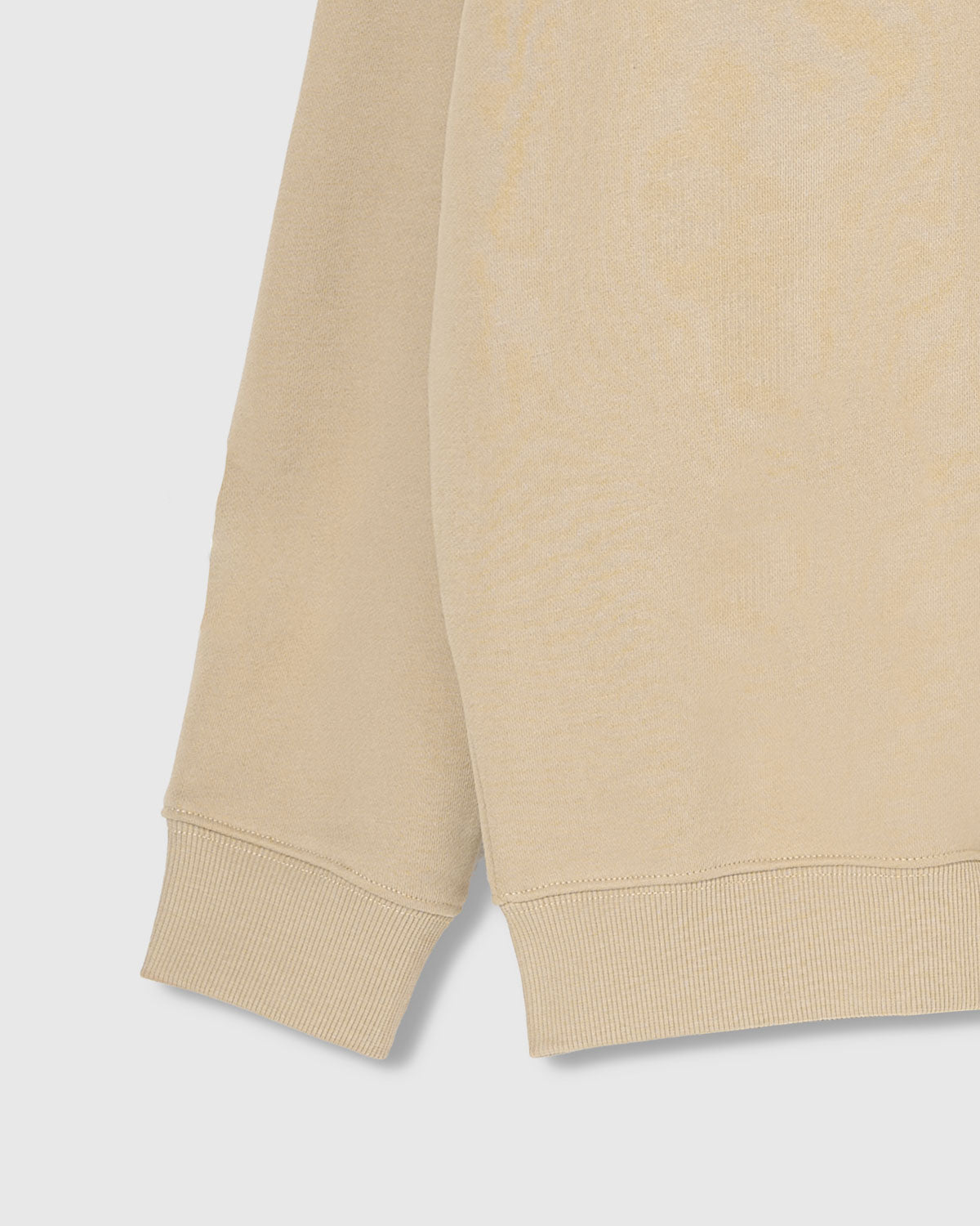 Close-up of ribbed cuff and hem on STICKYZOO cream Teddy Bear Sweatshirt showing premium construction