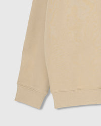 Close-up of ribbed cuff and hem on STICKYZOO cream Teddy Bear Sweatshirt showing premium construction
