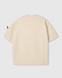 Back view of cream Dash Dachshund T-Shirt showing boxy silhouette and ribbed crew neckline