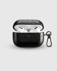 Black Croc case open with AirPods Pro seated inside, croc-embossed lid visible