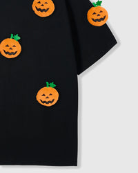 Model wearing Pumpkin Halloween T-Shirt showing dropped shoulders and pumpkin placement