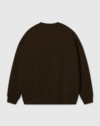 Back view of dark brown Gingerbread Joy Sweatshirt showing dropped shoulders and ribbed cuffs