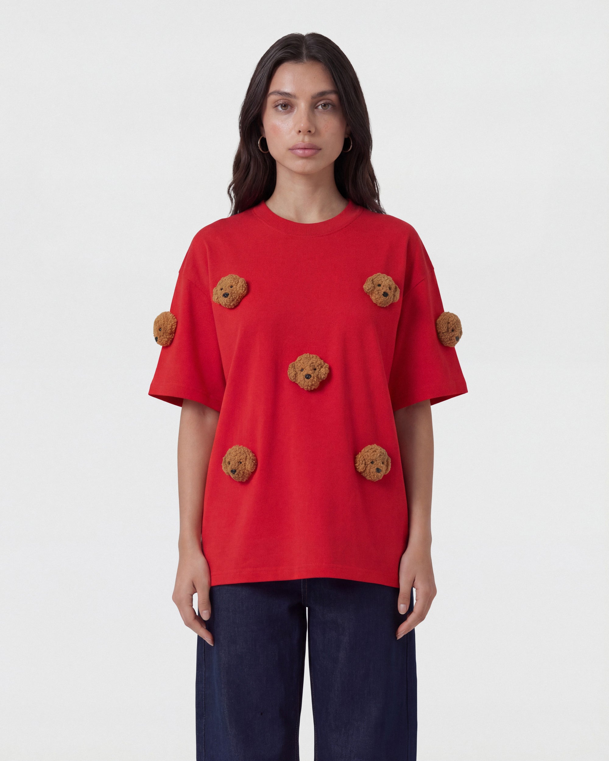 {{Runs true — oversized fit}} Model in red Poodle Parade T-Shirt front view showing all seven plush poodle appliques