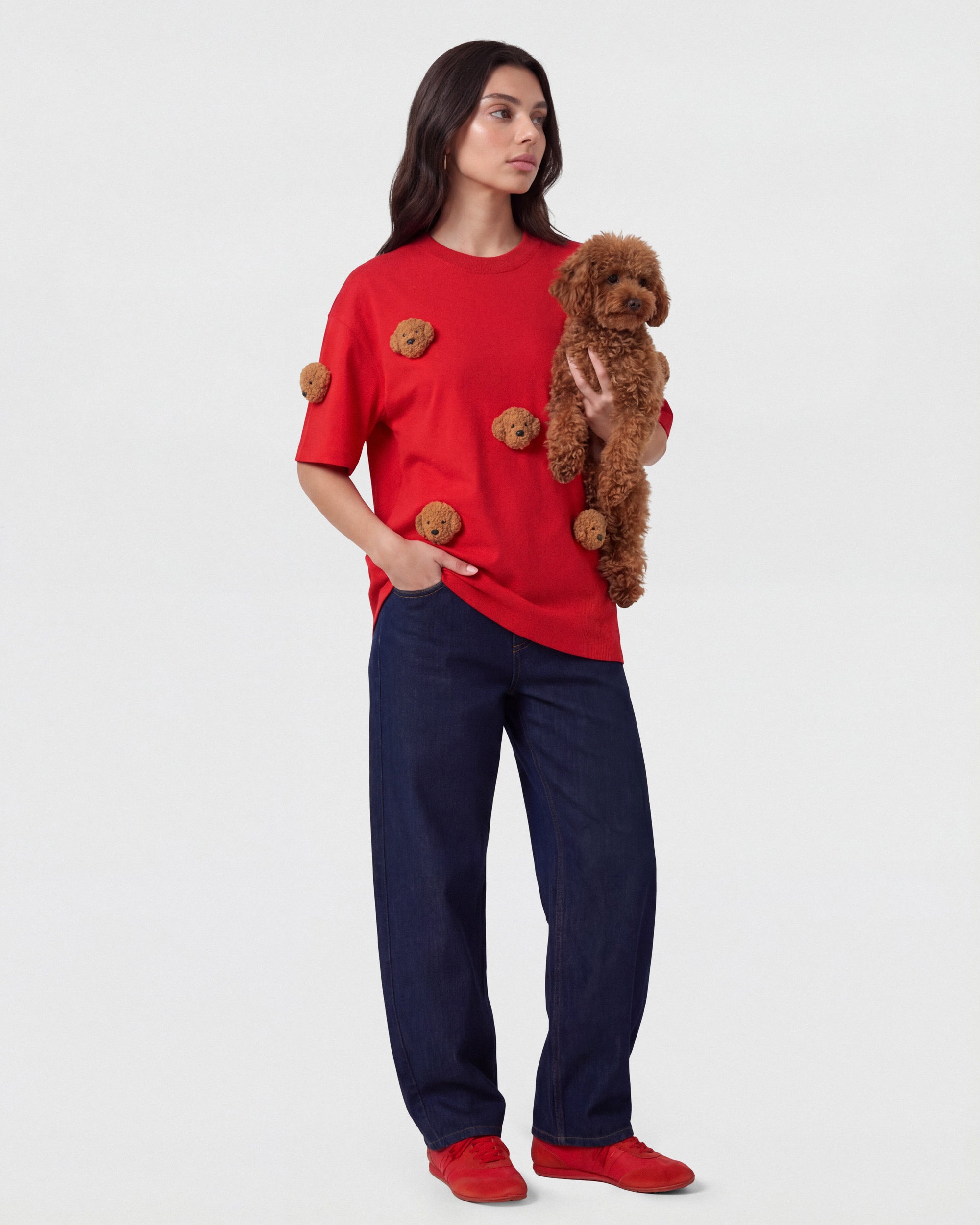 {{Model is wearing size M}} Model wearing STICKYZOO red Poodle Parade T-Shirt with a real poodle showing plush appliques