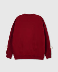 Back view of red Teddy Check-Ear Sweatshirt showing clean silhouette with white bear faces at cuffs